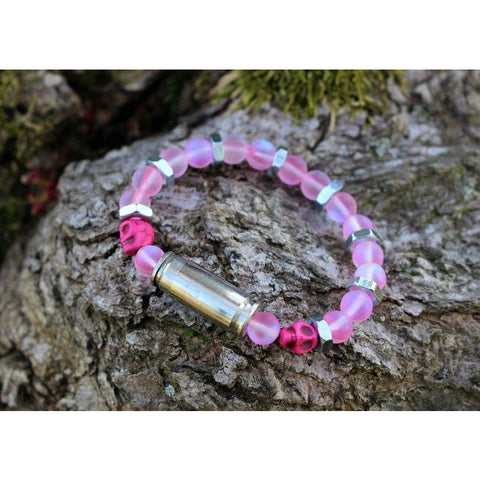 Iridescent pink stretch bullet bracelet with hot pink skulls